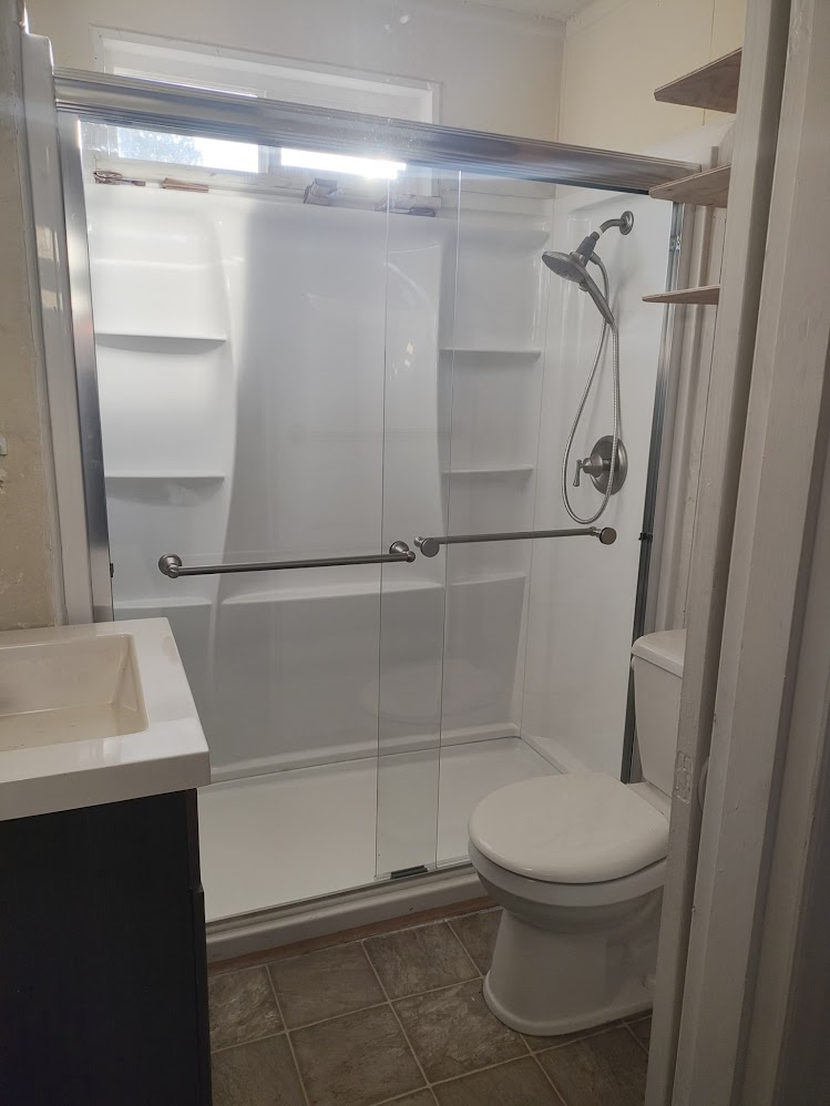 bathroom with modern walk-in shower
