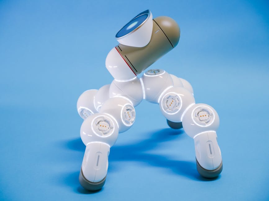 A futuristic-looking robot with a sleek design, featuring multiple jointed segments and a blue and white color scheme, set against a plain blue background.