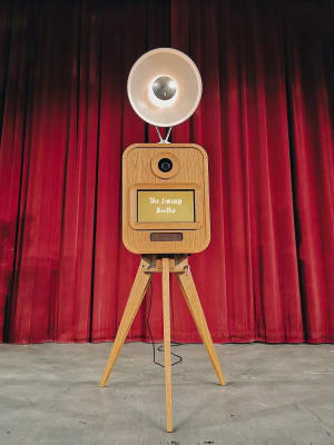 Guest enjoying vintage retro photo booth with instant prints