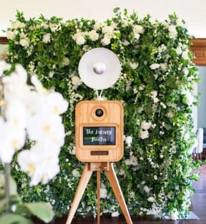 Vintage photo booth setup with retro style and instant prints