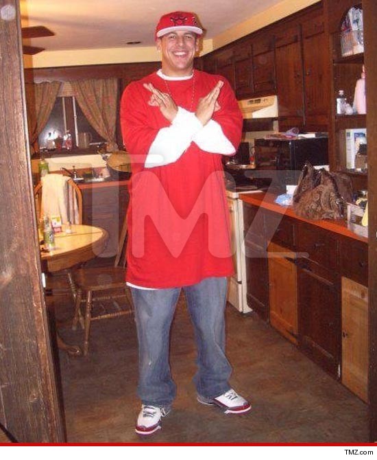 Hernandez in red showing gang sign