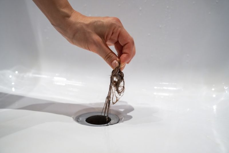 Drain cleaning with a professional plumber snake