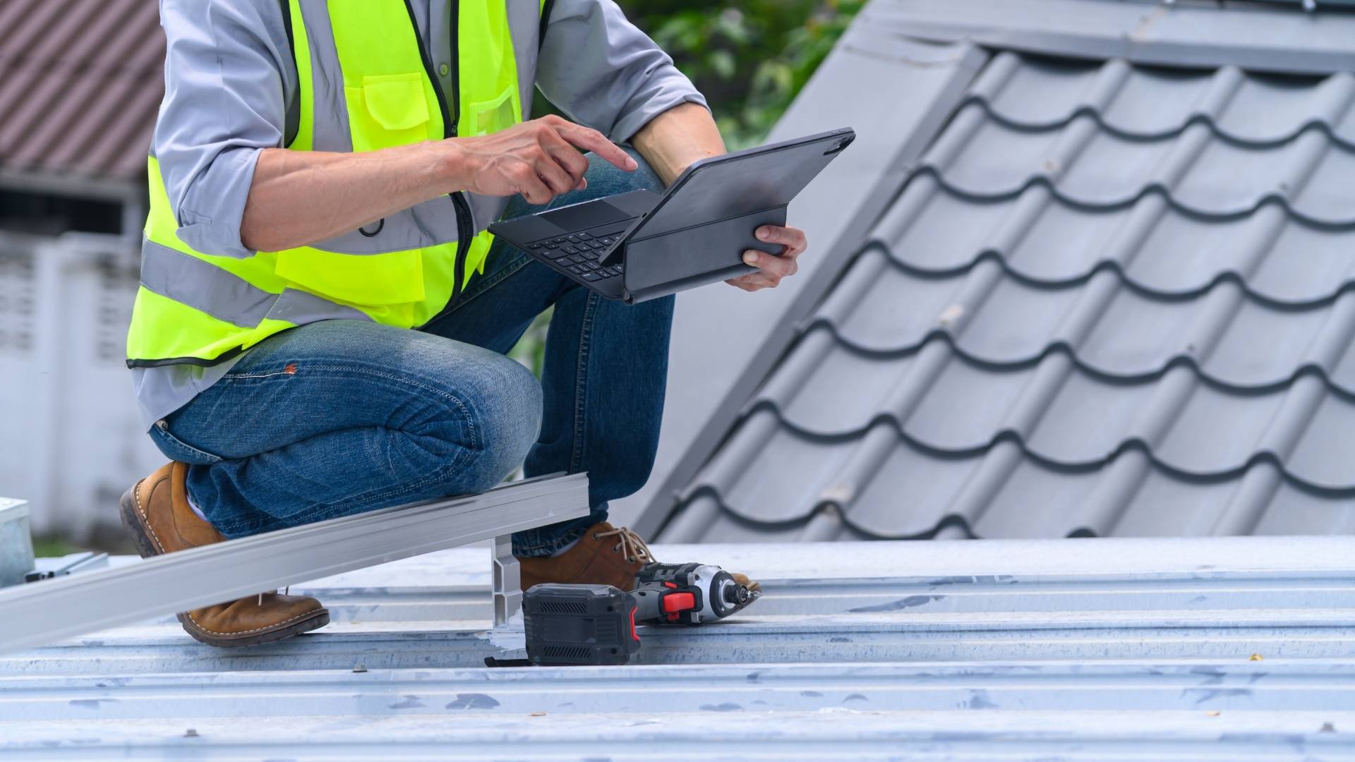 Roofer performing detailed roof inspection for a homeowner
