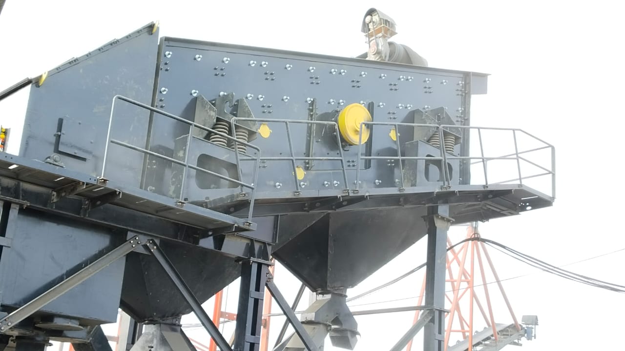 Industrial stone crusher operation at a quarry site