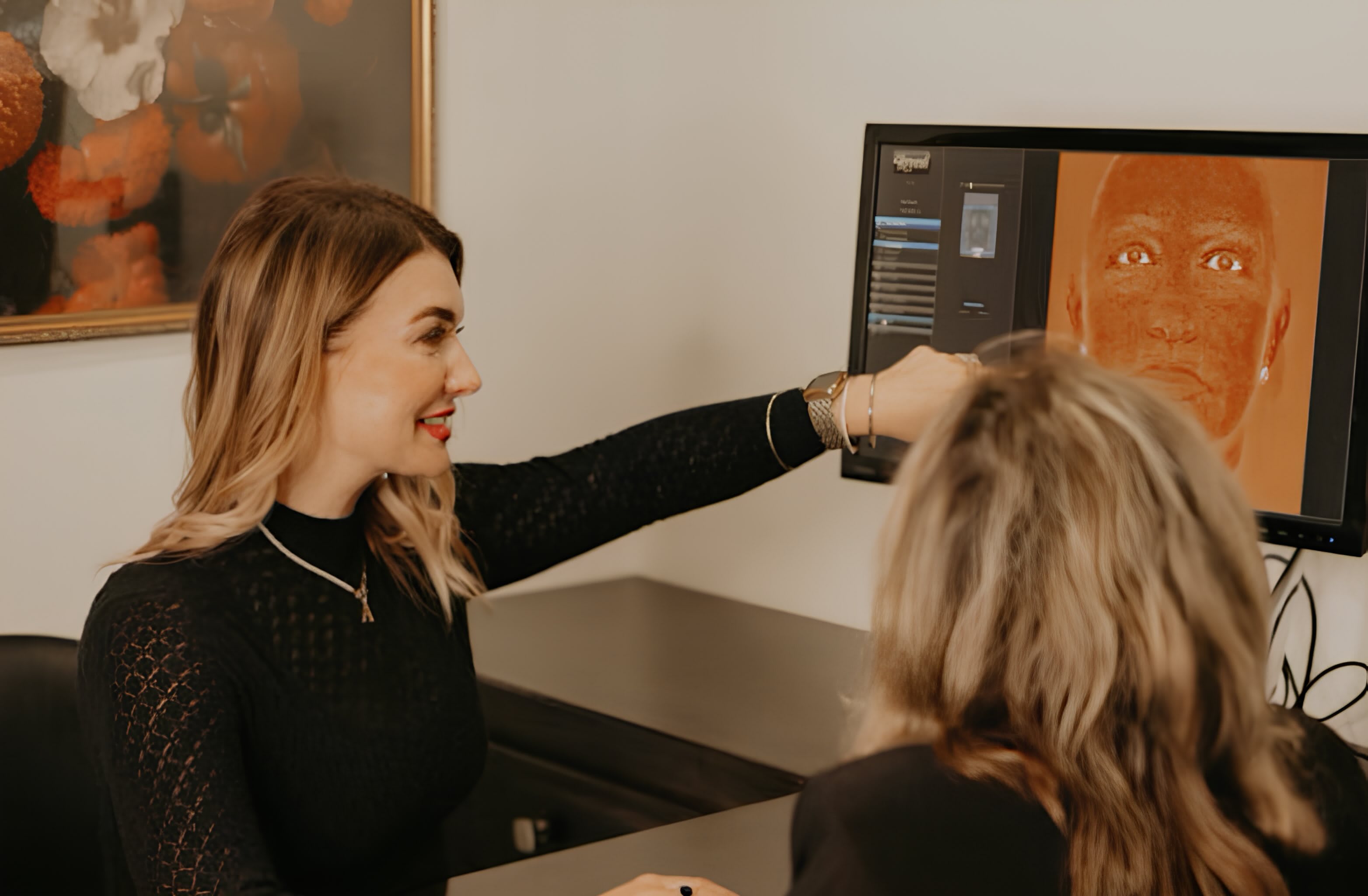 An Aspen Medical Aesthetics provider reviewing a skin analysis with a client.