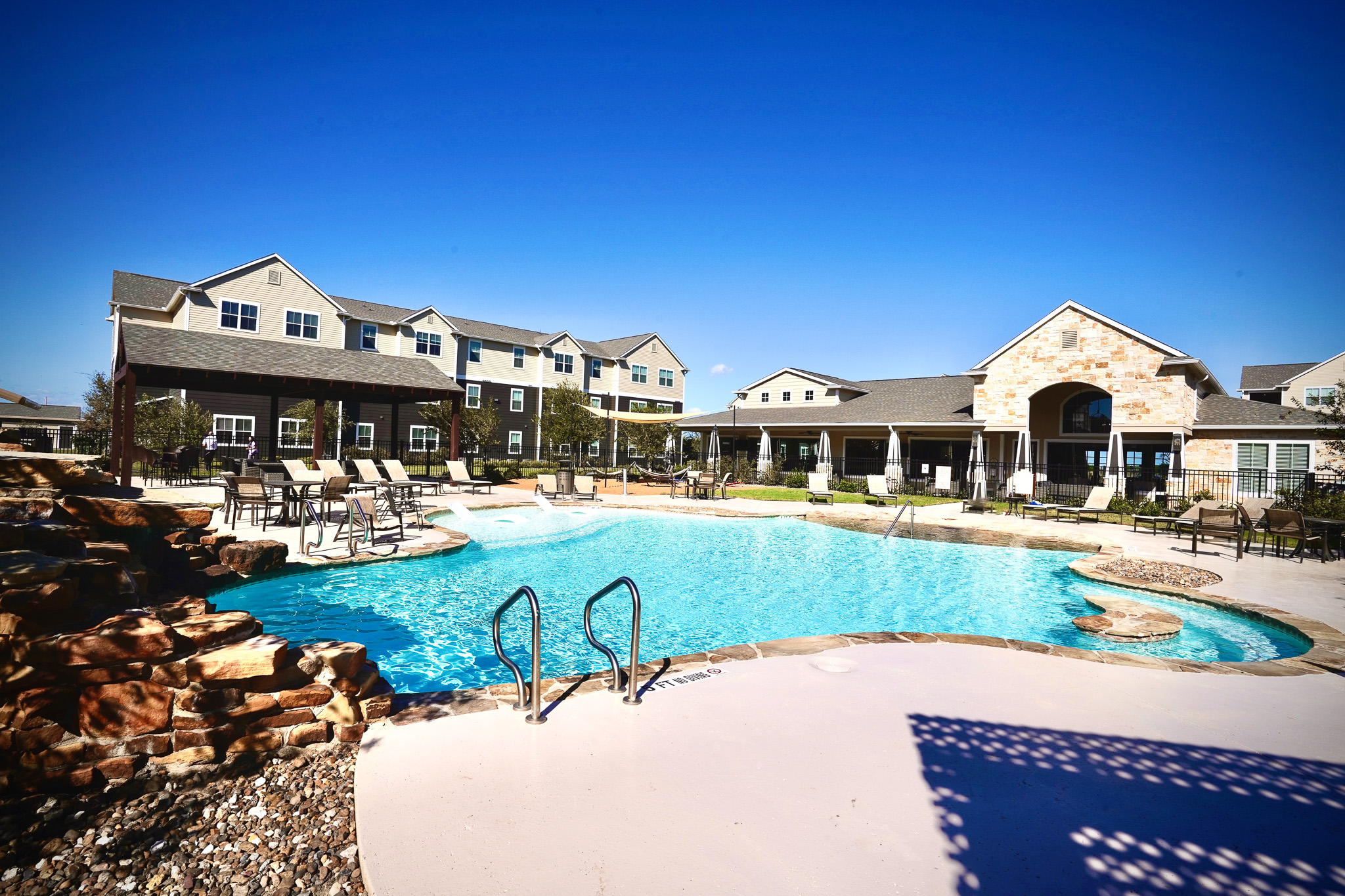 Resort-style pool at Oak Tree apartments in Kingsville, TX