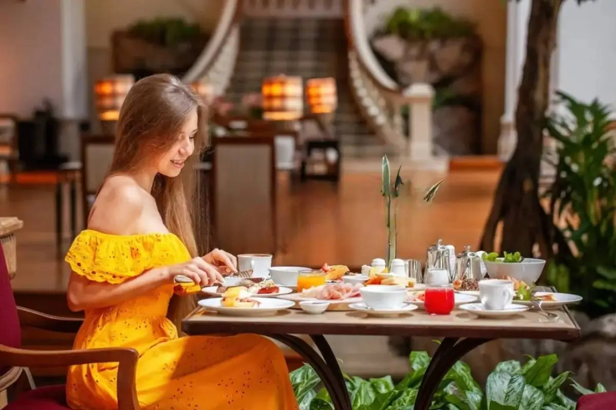 Woman enjoying full course meal luxury restaurant