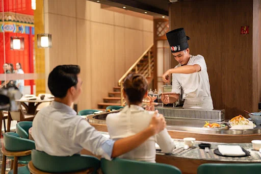 Waiter serving a guest at a restaurant