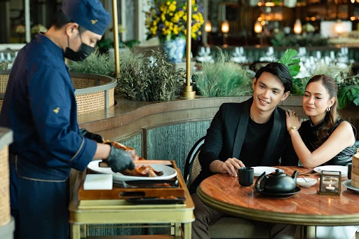 A man and woman seated at a restaurant table