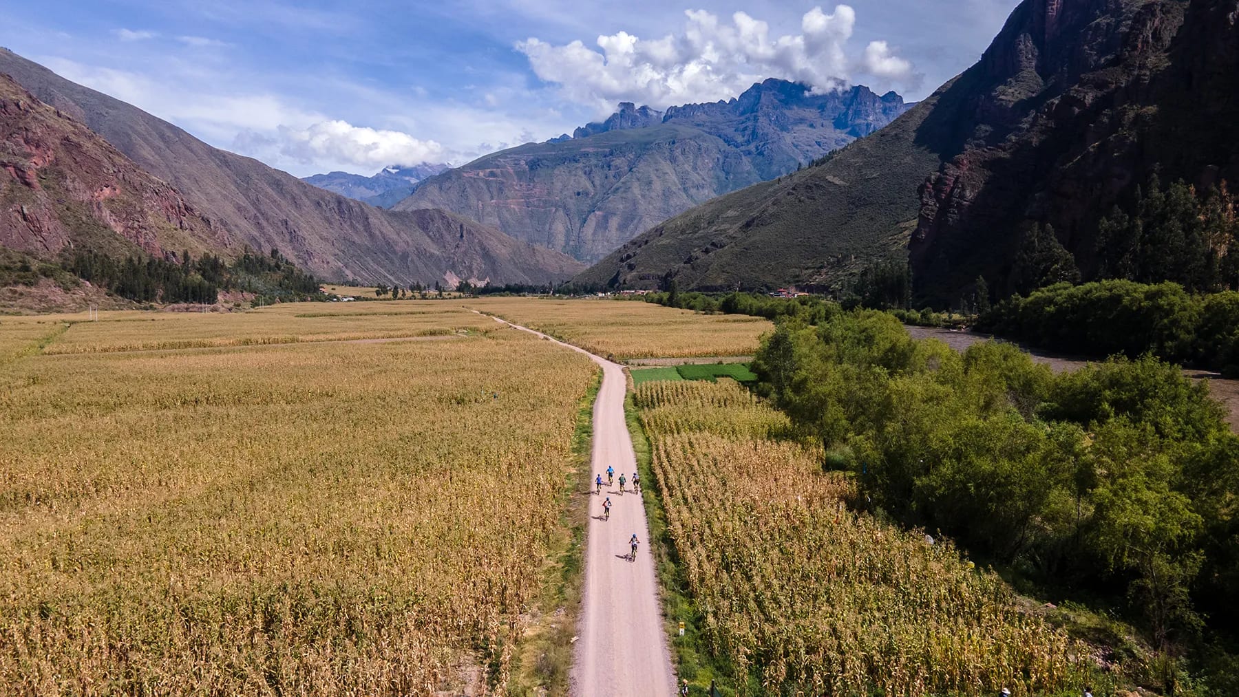 Riders enjoy a private mountain bike tour in Cusco's Sacred Valley. The riders cycle along the Sacred Valley Bike Corridor on rental bikes available from a bike shop in Lamay