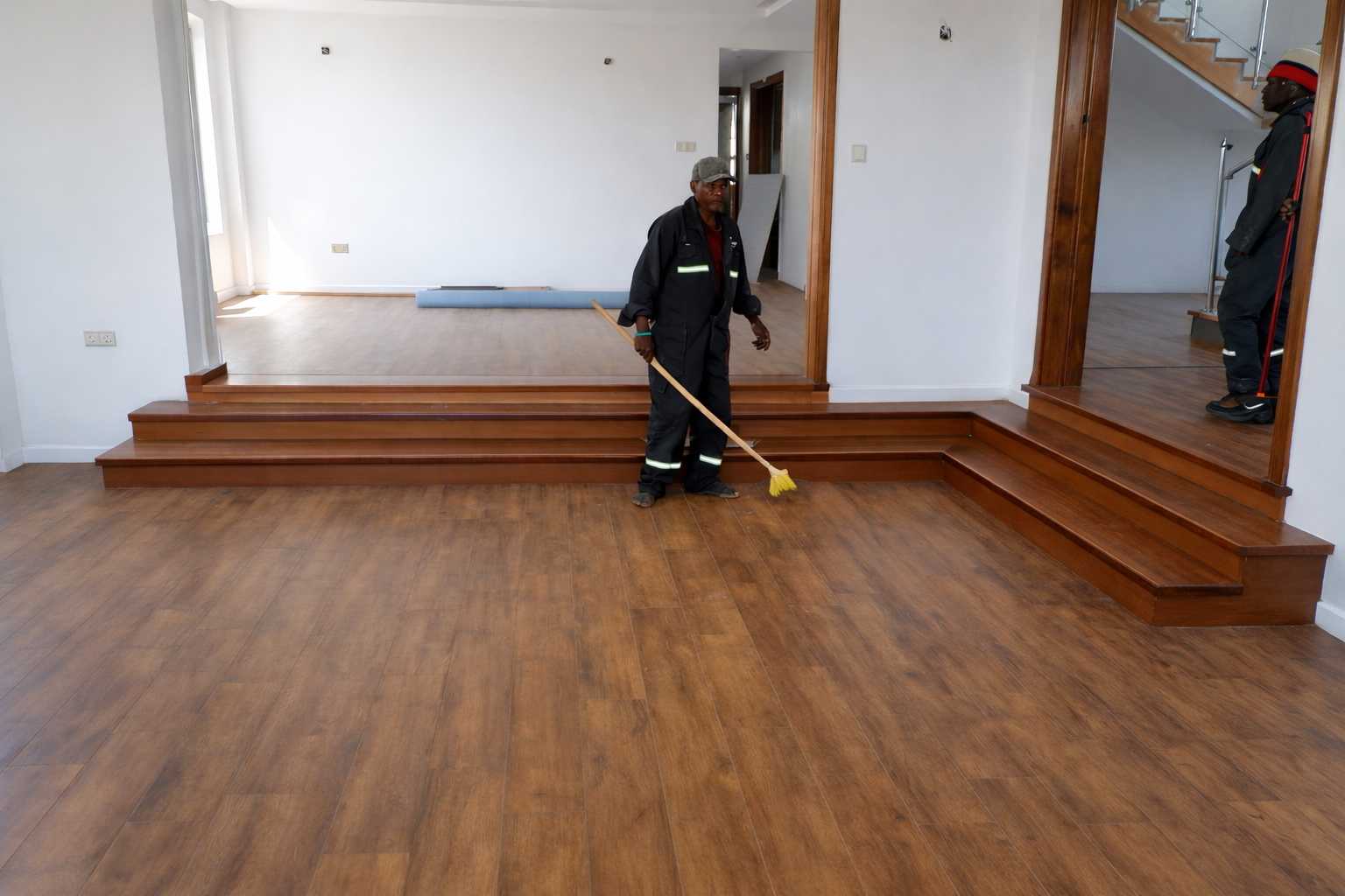 After: wood-look laminate flooring installed and finished