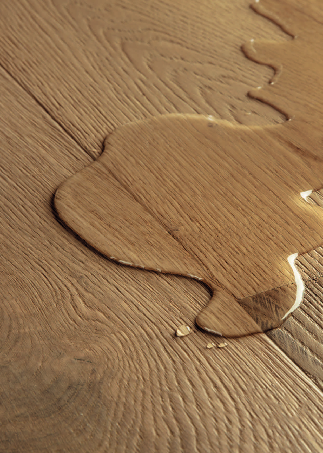 Close-up of waterproof protected joints on engineered wood flooring