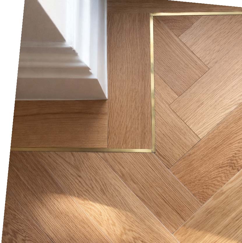 Brass inlay engineered wood flooring installation - requires glue-down method