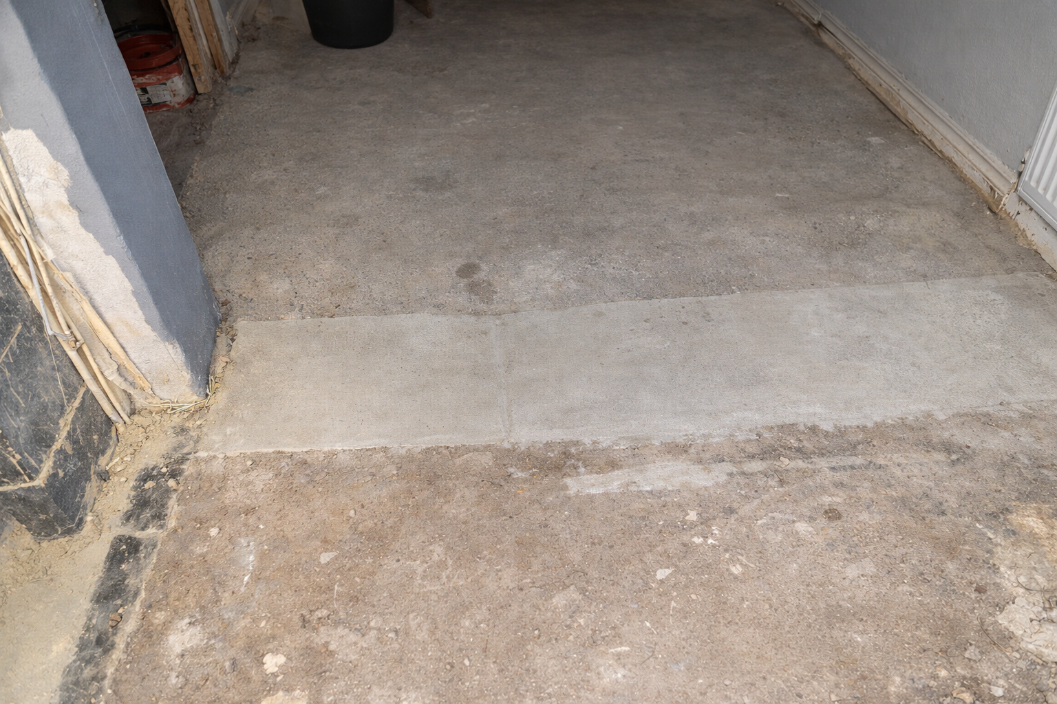 Uneven cement concrete slab subfloor in Kenya before flooring installation