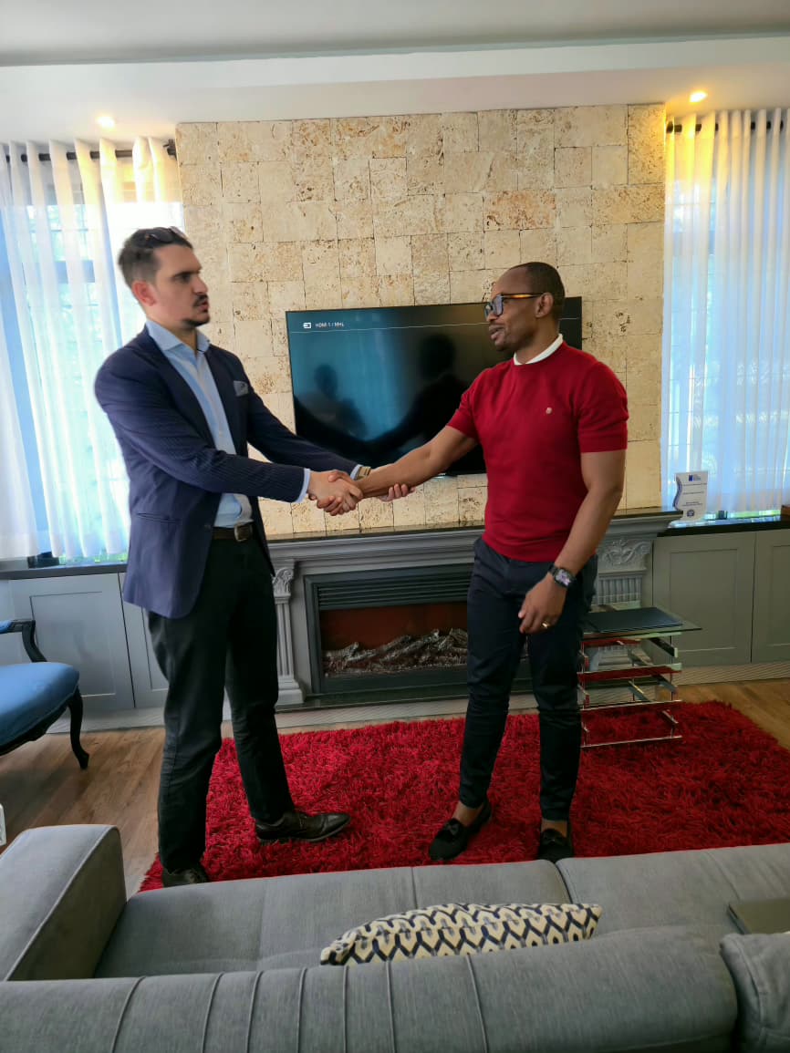 Paul-Lucas Lambert and Keith Walumbe discuss flooring practices in Kenya