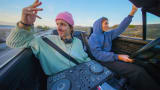 playing vibey tunes on the highway
