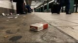 Environment: “34th Street–Penn Station” Character: “Discarded pack of cigarettes”  Genie 3: