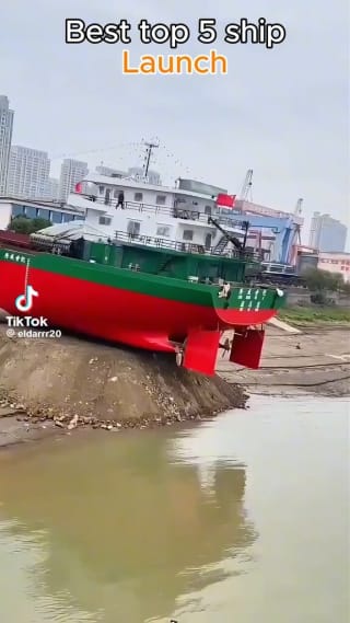 How are large ships launched from dry land?
