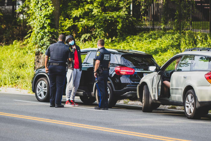 boy stopped by the police for traffic neglation