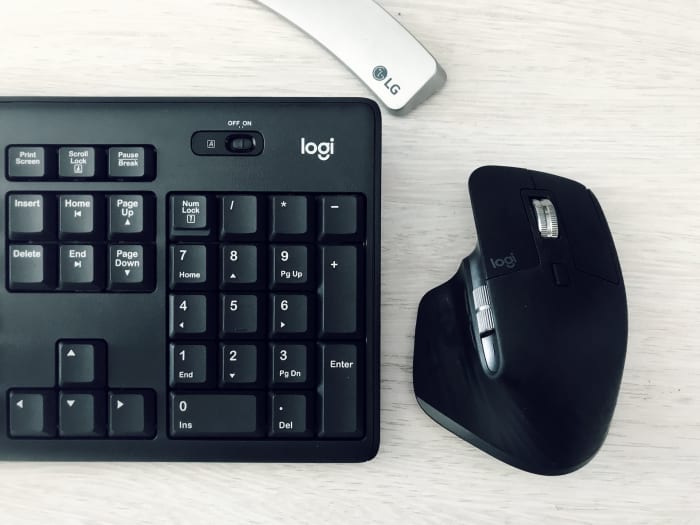 a black mouse and a black keyboard