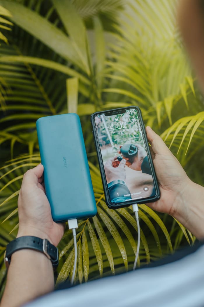 a portable charger connected to a phone