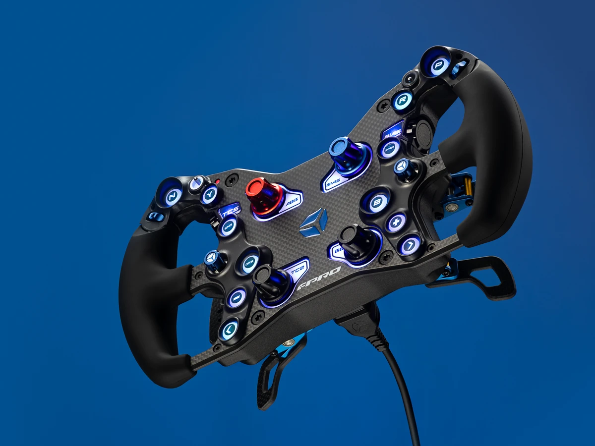 Cube Controls FPRO steering wheel floating in the air. Advertising photography by Steve Wyper