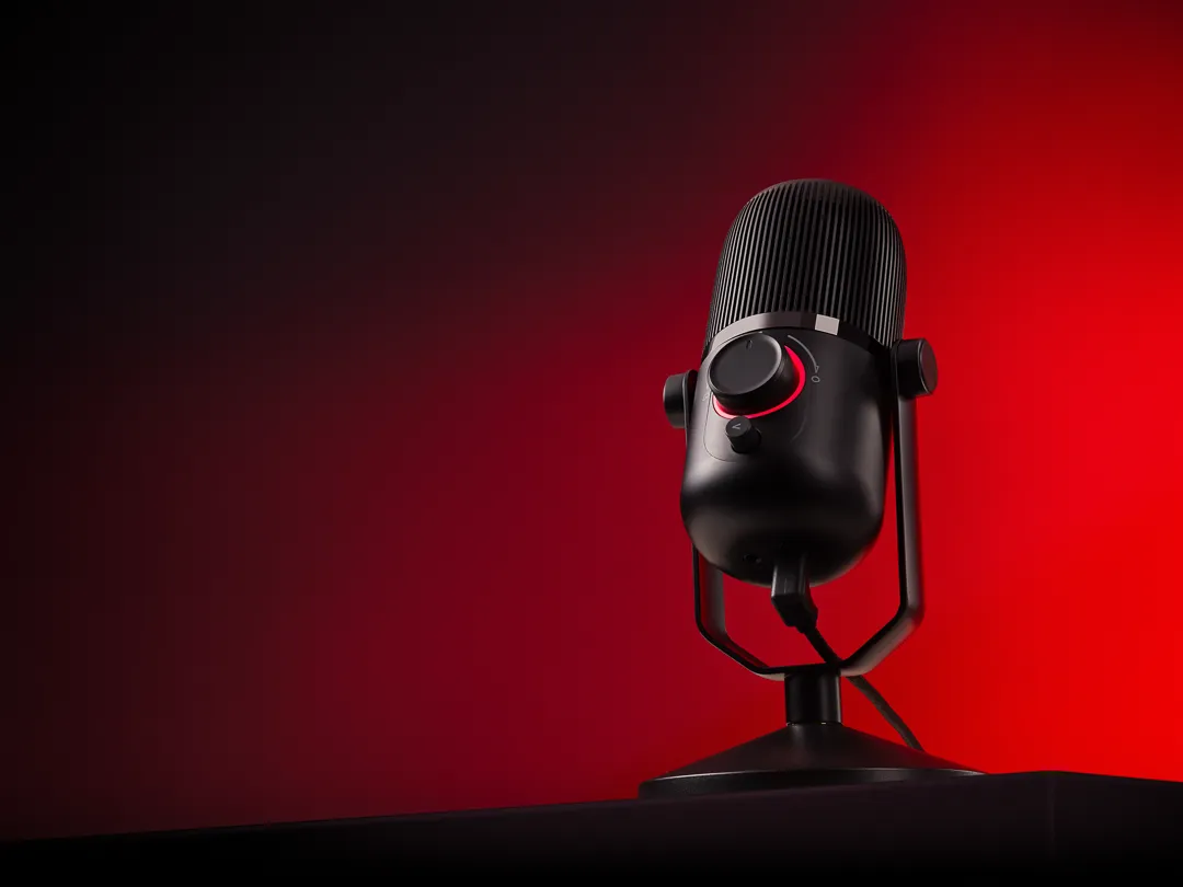 Thronmax mic on a table with a red background | Advertising photography by Steve Wyper