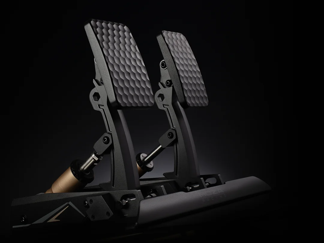 Moza sim racing pedals on a dark background showing lots of texture in the pedal faces