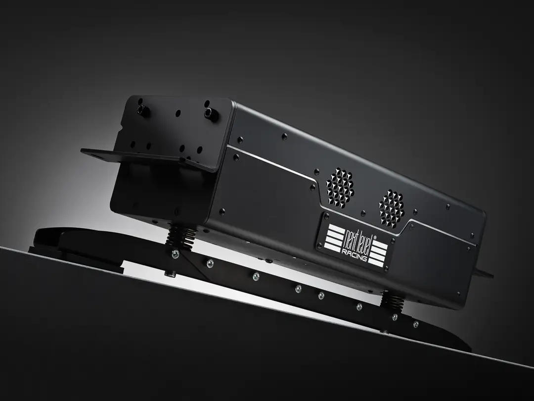 Next Level Racing Motion Plus Platform on a grey gradient background