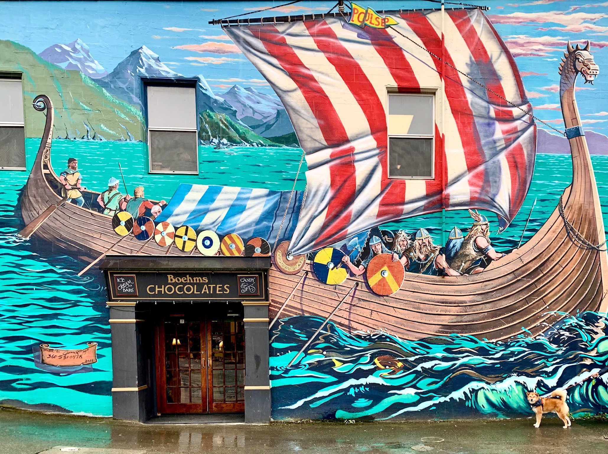 Markus posing by the corner of a Viking mural in Poulsbo, Washington also known as Little Norway