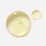 Kroppsolje fra Dr. Hauschka Natural Skincare med en gylden oljekonsistens