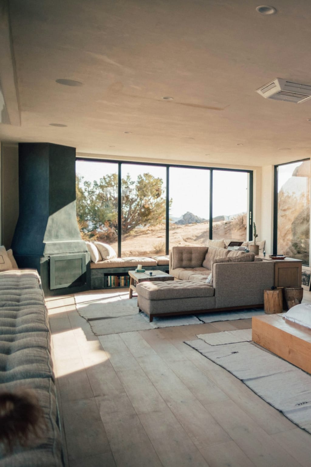 A bedroom opening onto a terrace with the sea beyond