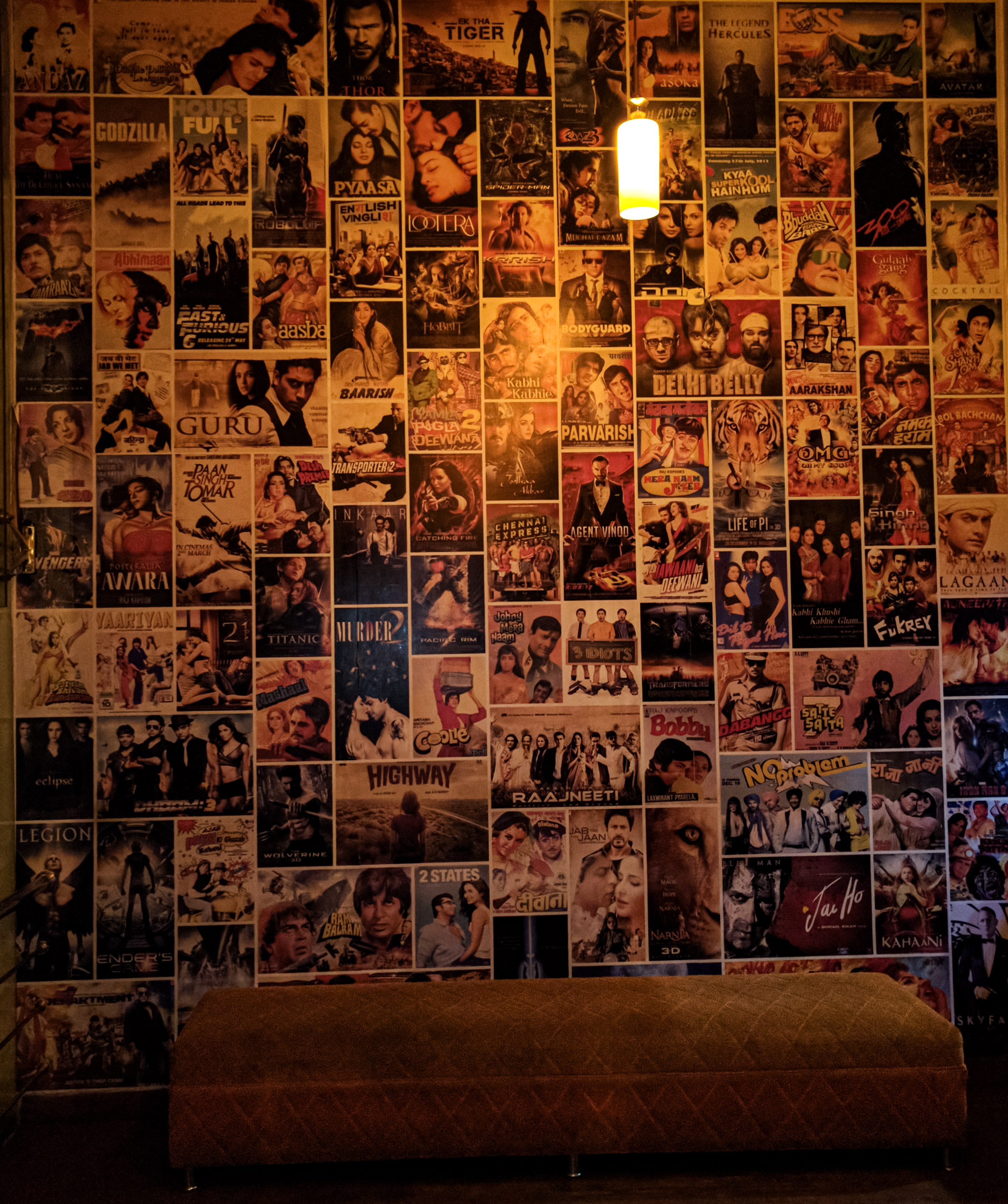 A wall covered in Hindi and English film posters inside Miraj Cinemas, the old Geet Talkies, in Bhilai, 2016