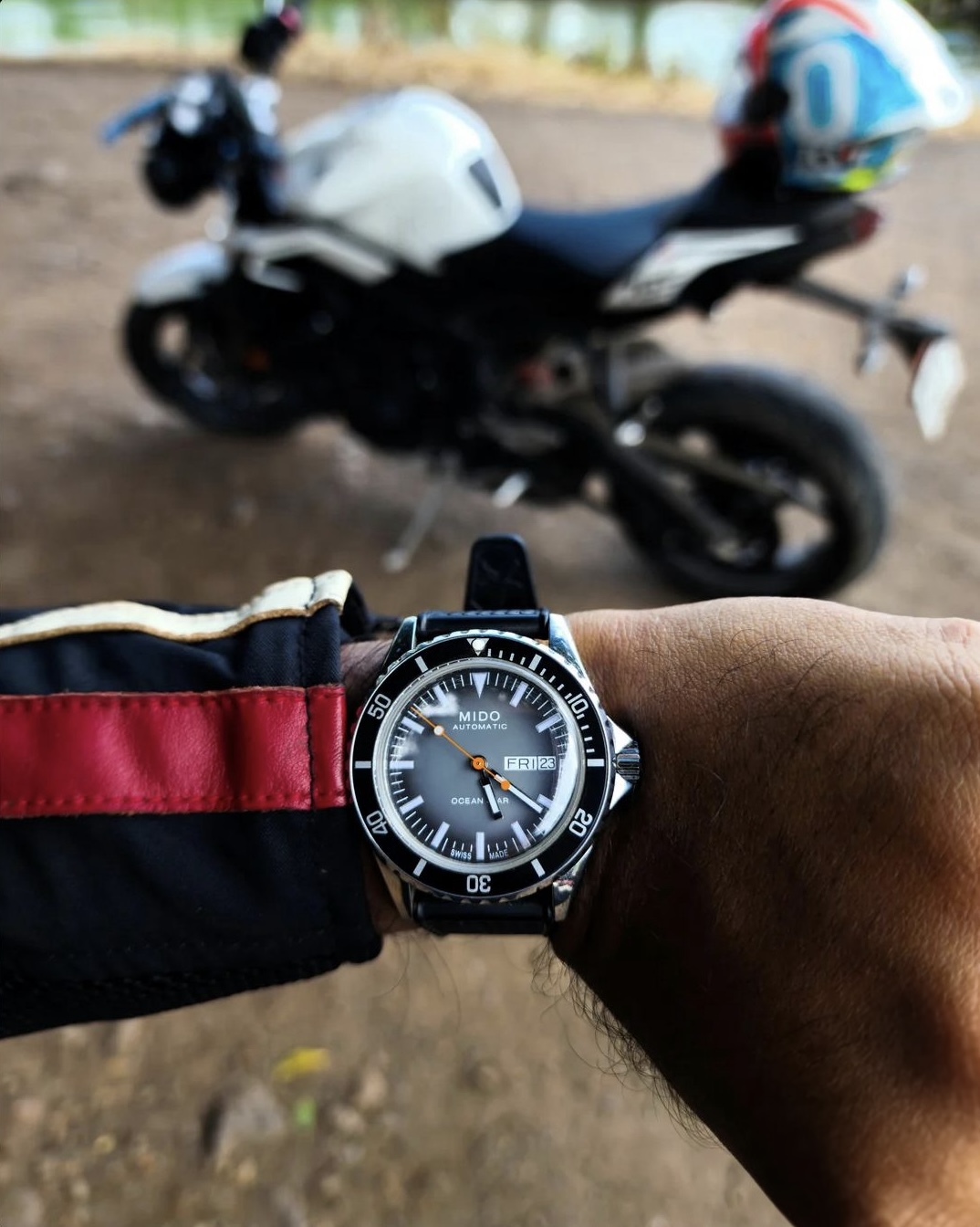 Mido Ocean Star Tribute Gradient on my wrist, with the Triumph Street Triple parked behind