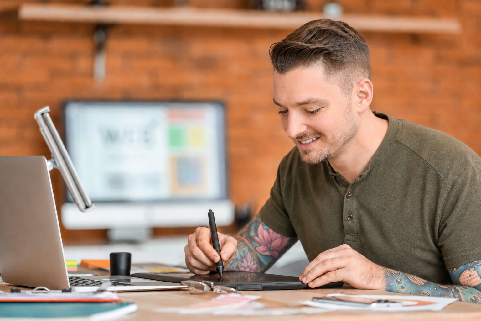 Local SEO specialist using a digital tablet at an office desk to create and optimize digital marketing content.