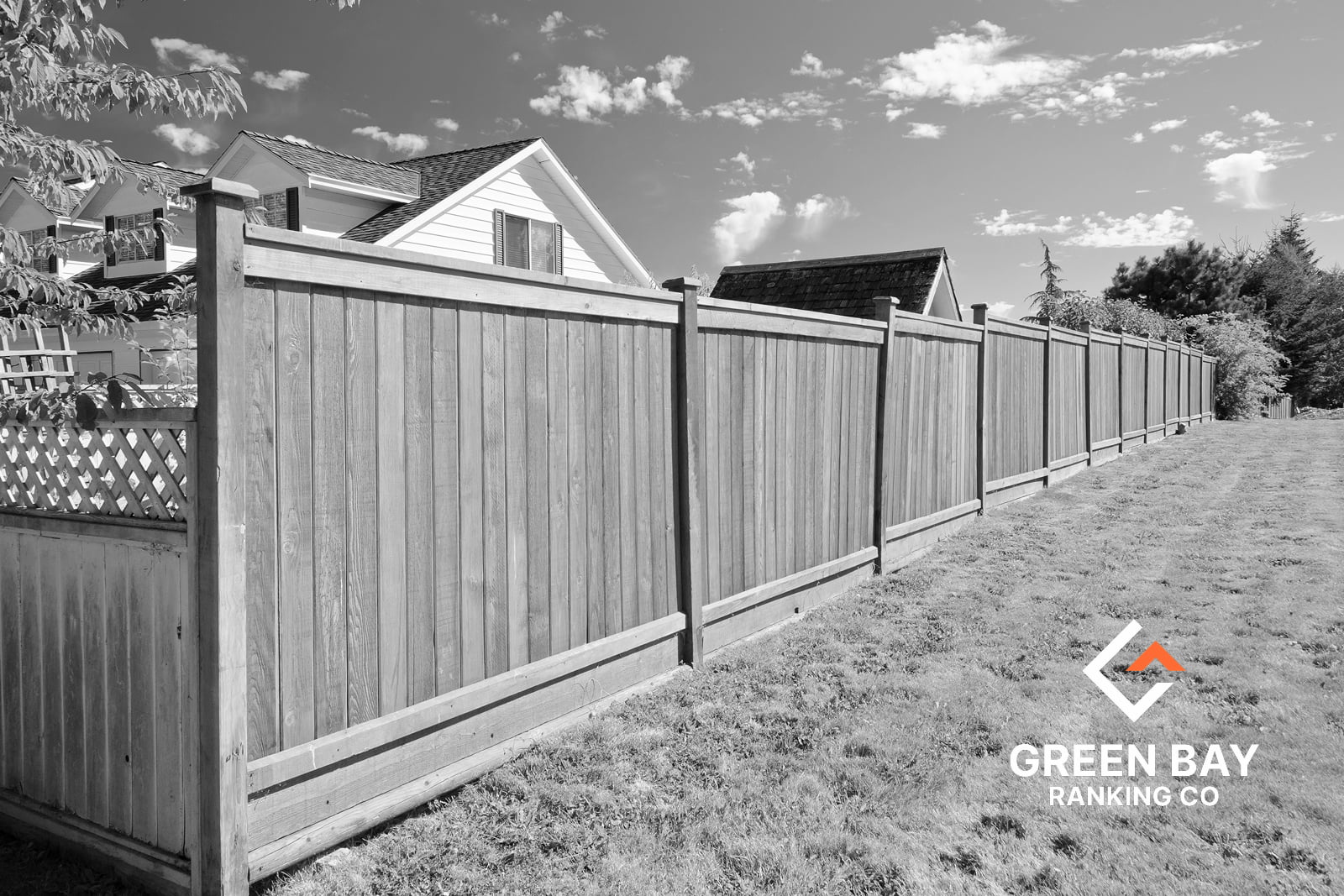 Wood privacy fence installation in Green Bay, WI, by Green Bay Ranking Co., featuring tall residential fence panels.