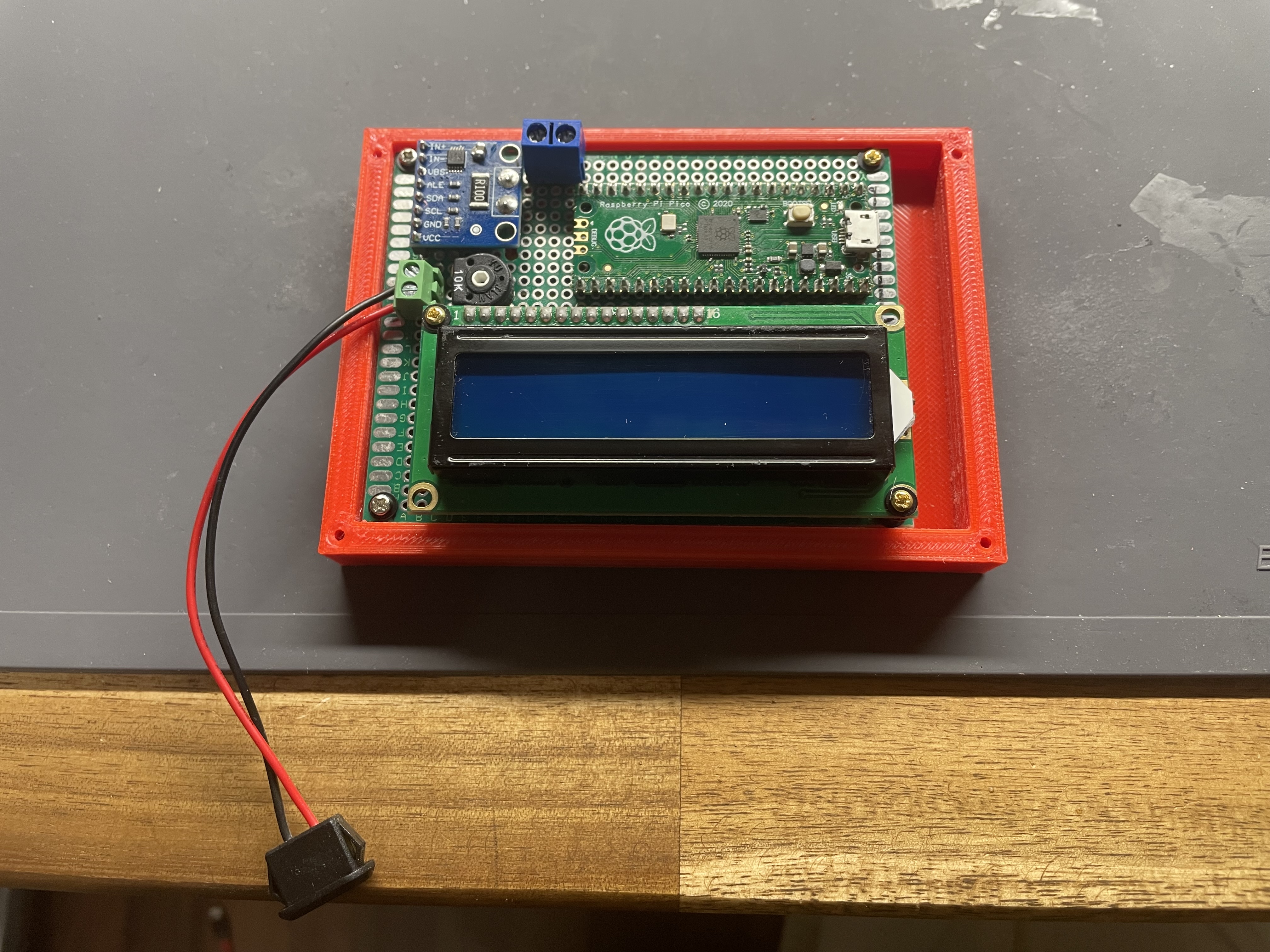 housing-bottom-screwed-to-current-monitor-breadboard