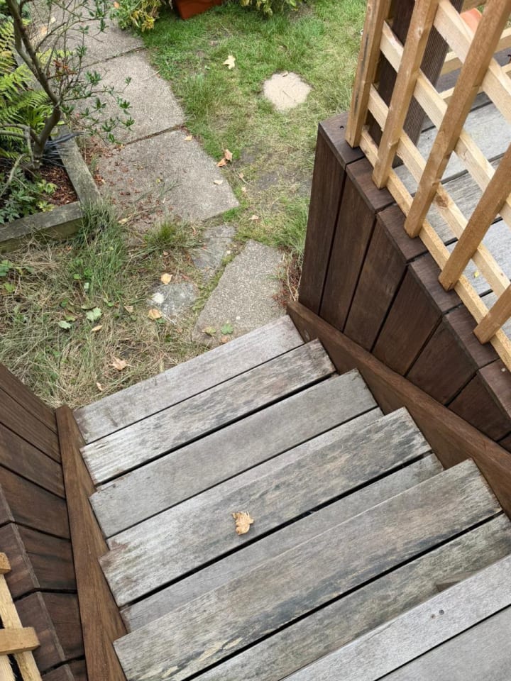 Weathered grey timber decking steps before cleaning and oiling