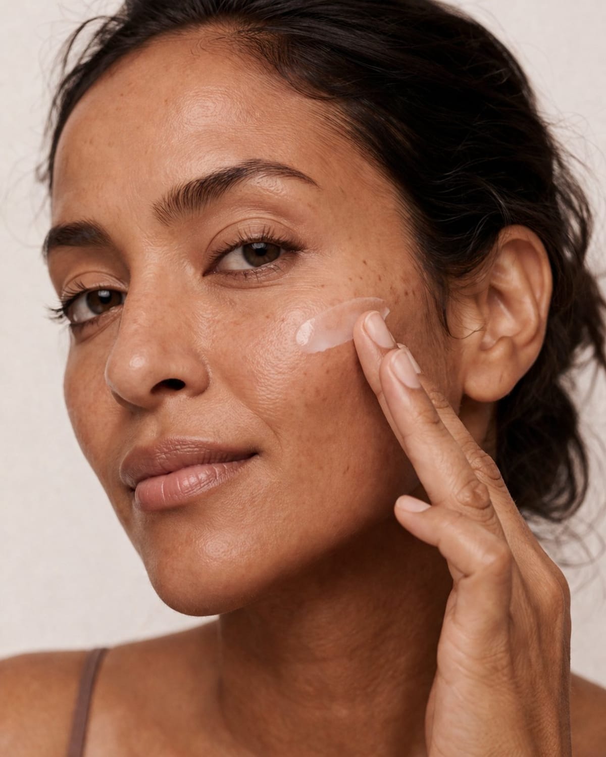 Active Suncream on medium-dark skin tone — type V