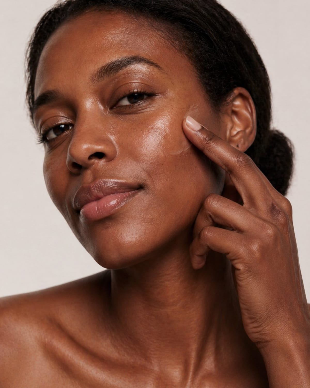 Active Suncream on deep-brown skin tone — type VI