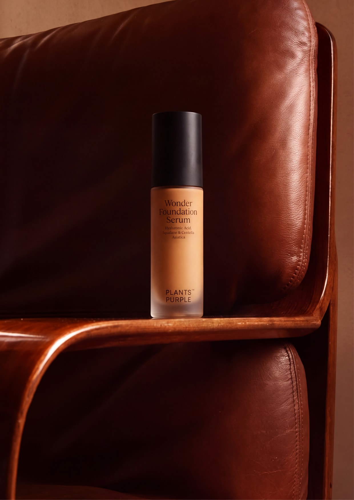 Wonder Foundation Serum on a brown leather armchair