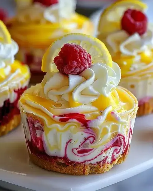 Luscious Lemon Raspberry Swirl Cheesecake Cups in a mini muffin tin