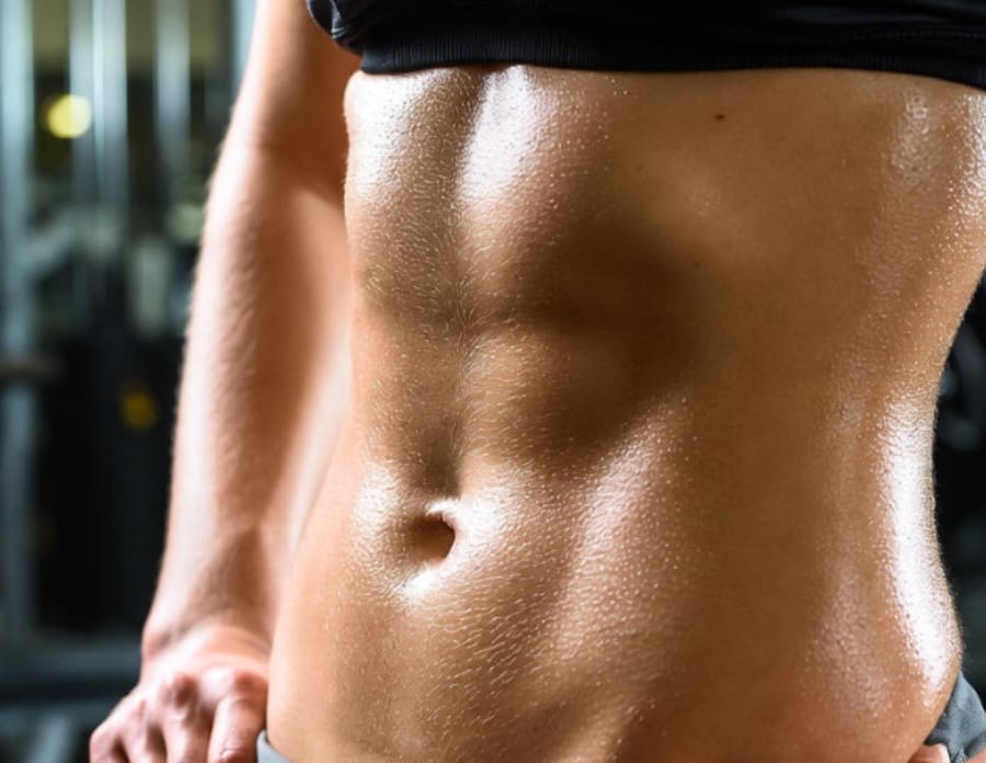 Toned midsection representing healthy body composition without stimulants