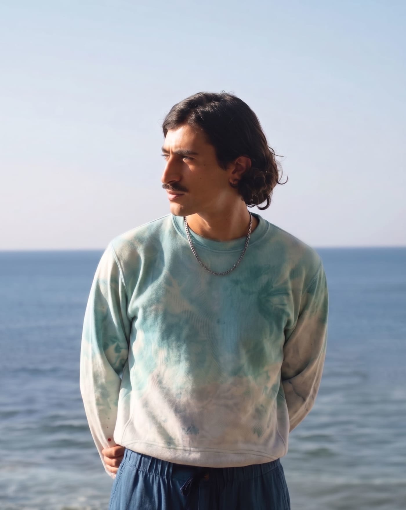 The crew neck, worn at the water, blue breaking to white.