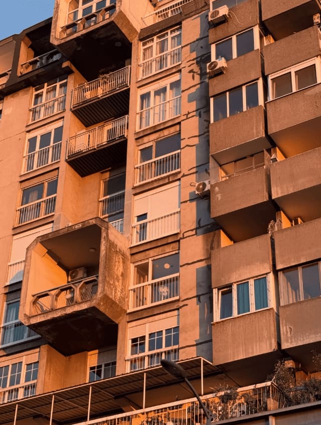 balconies, west-facing, an hour before dark