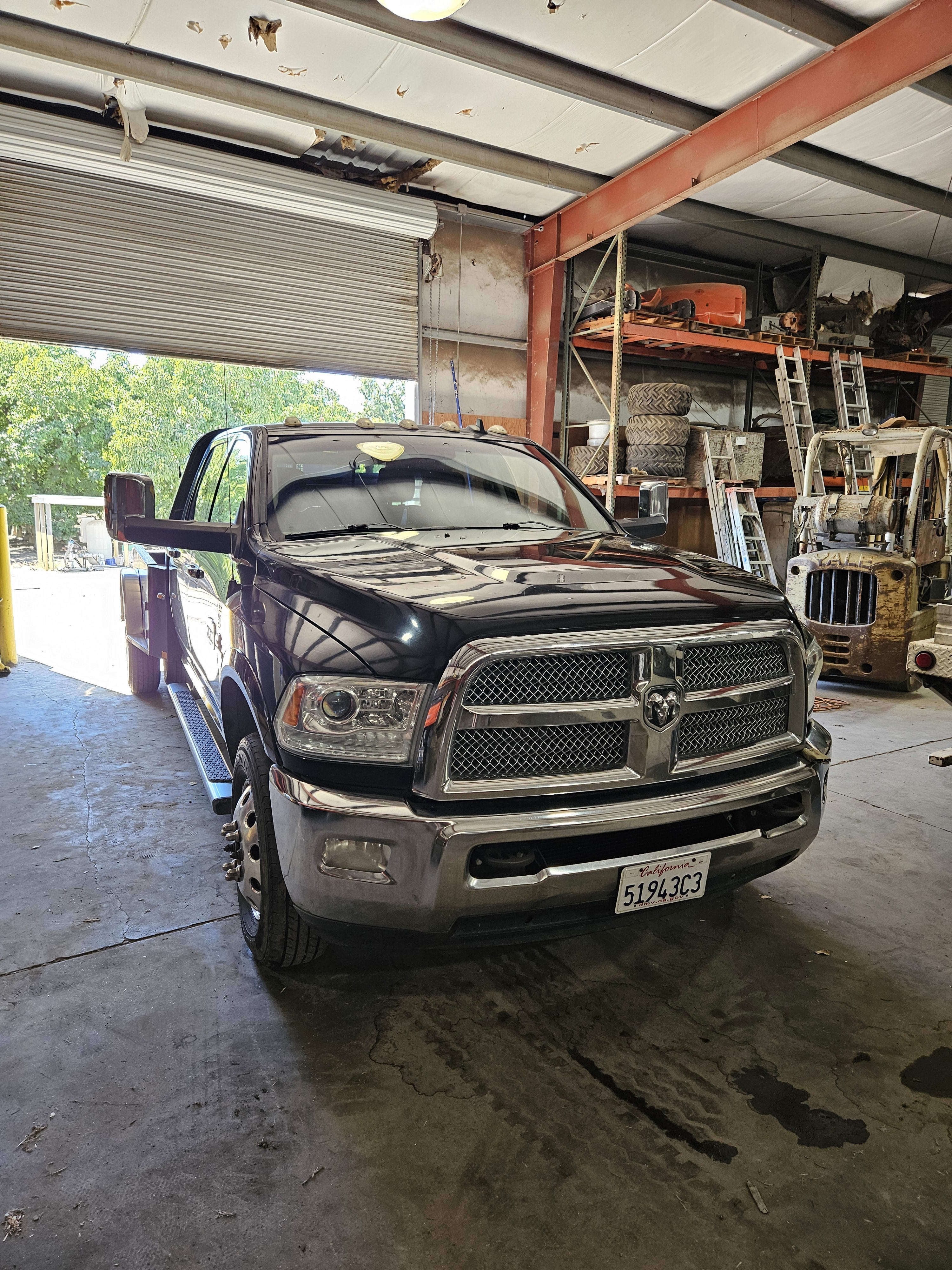 Black Ram truck before and after a full detail, after repair