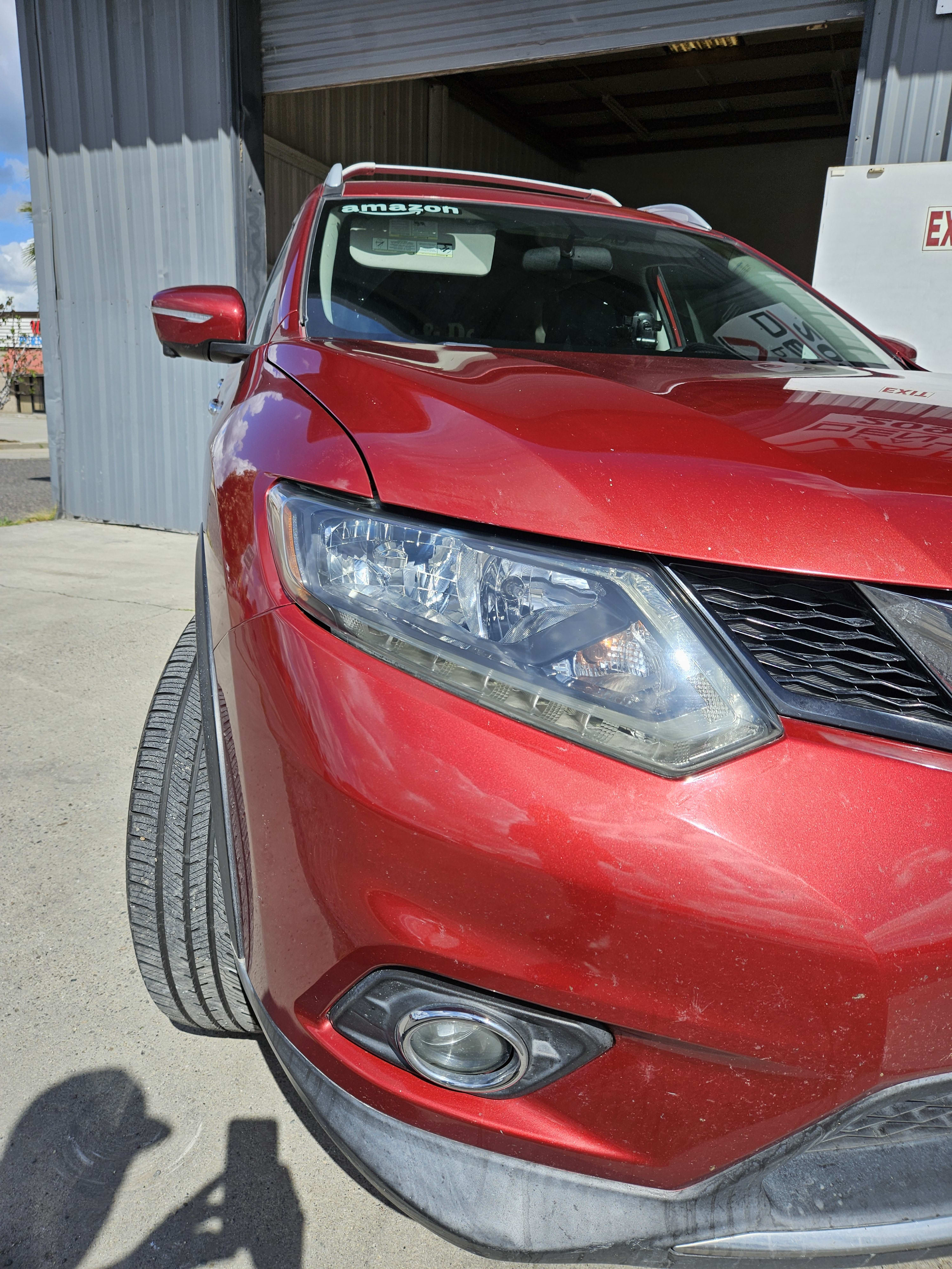 Headlight restoration on a red car, after repair