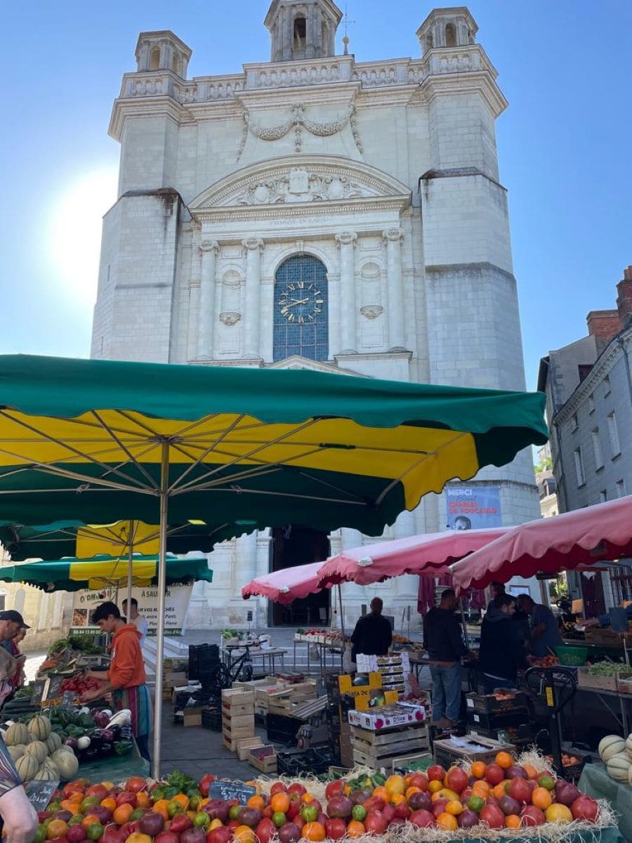 A bustling French market scene with fresh produce