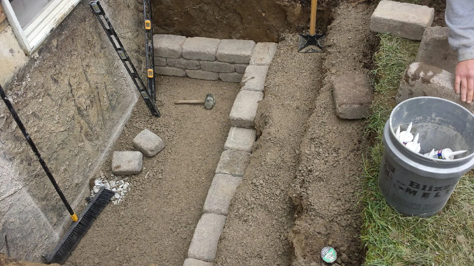 Custom Stone Egress Window Well Step One