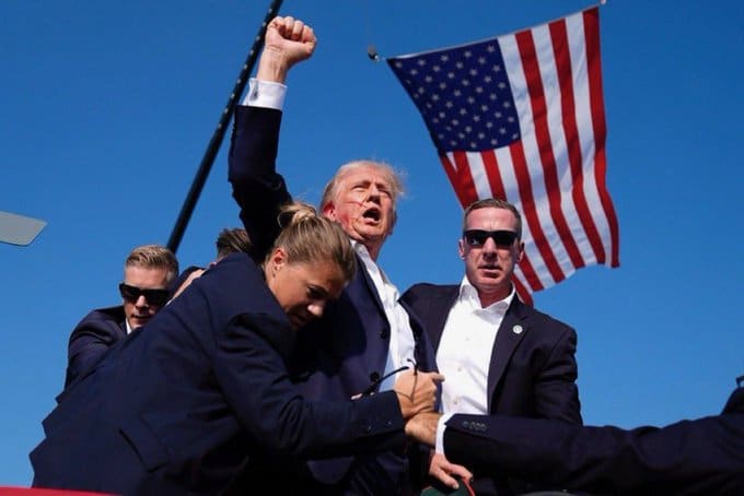 Photo of trump with a fist in the air after surviving bullet to the ear